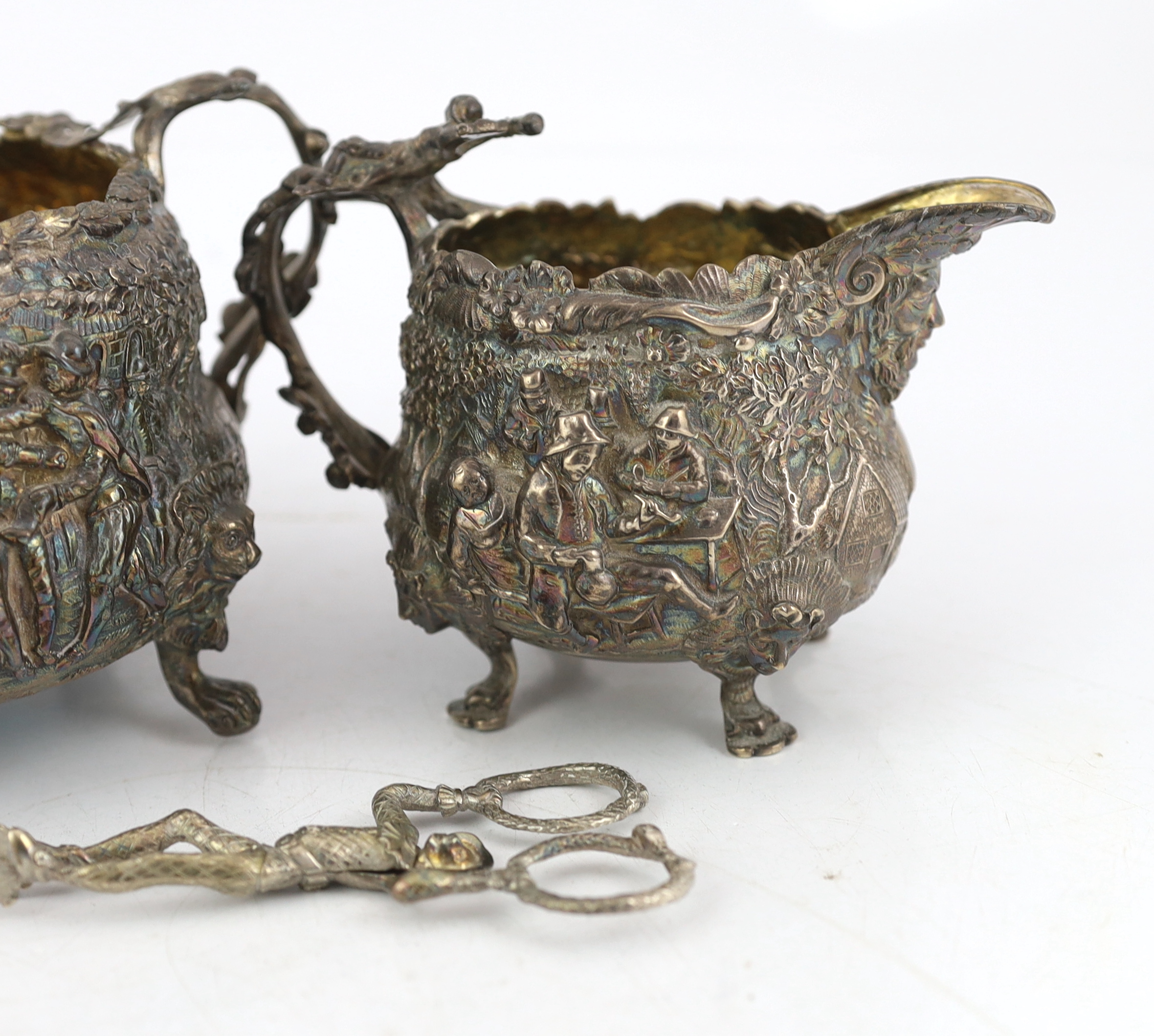 A George IV embossed silver sugar bowl and cream jug by Edward Farrell